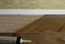 The parquet floor goes under the skirting which remained in place